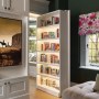 Epping Forest family home | View of library secret door from cinema room | Interior Designers